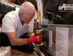 Technician working on a home heating system